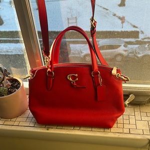 Brand new never worn Coach red genuine leather purse with handles and arm strap!